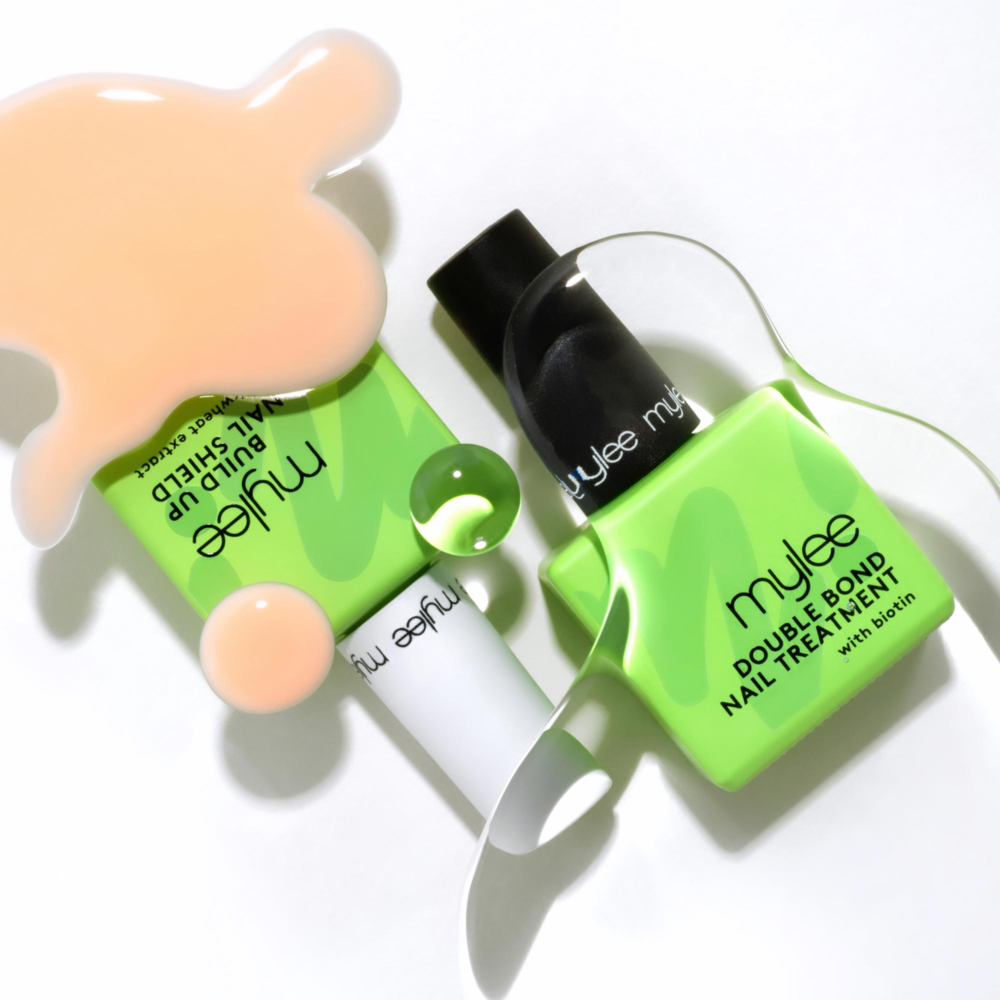 Mylee Double Bond Nail Treatment bottles with glossy liquid spills on white background — Leo Acker, London product photographer and still life photographer Leo Acker Photographer MYLEE 
