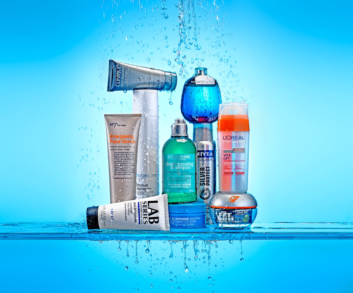 Men's grooming and skincare product still life photography for John Lewis by Leo Acker, London — Clinique, No7, L'Occitane, Nivea, L'Oréal Men Expert and Fudge with dramatic water splash on blue background Leo Acker Photographer JOHN LEWIS 